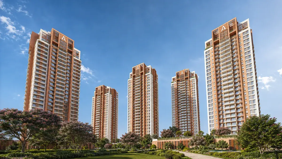 Aparna Wonder Woods terracotta-and-white high-rise towers above the vehicle-free landscape podium at Mallasandra, Off Kanakapura Road